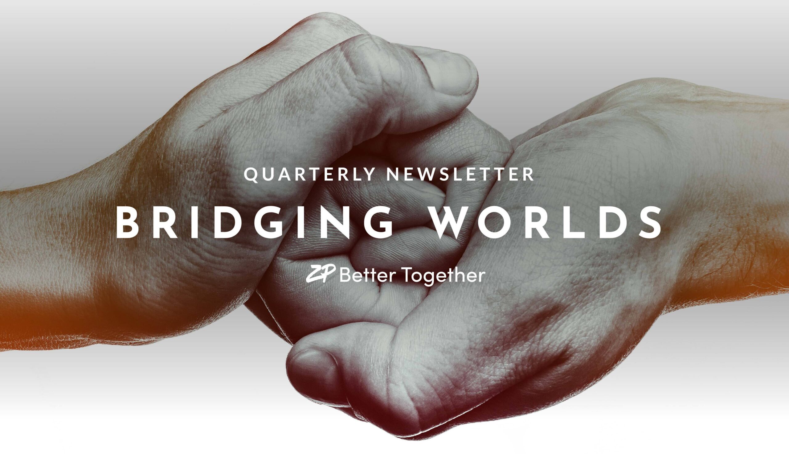 holding hands in background with text in front-"bridging worlds"